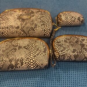 Original Paris design Black and White Snakeskin Wristlet cosmetic pouch.